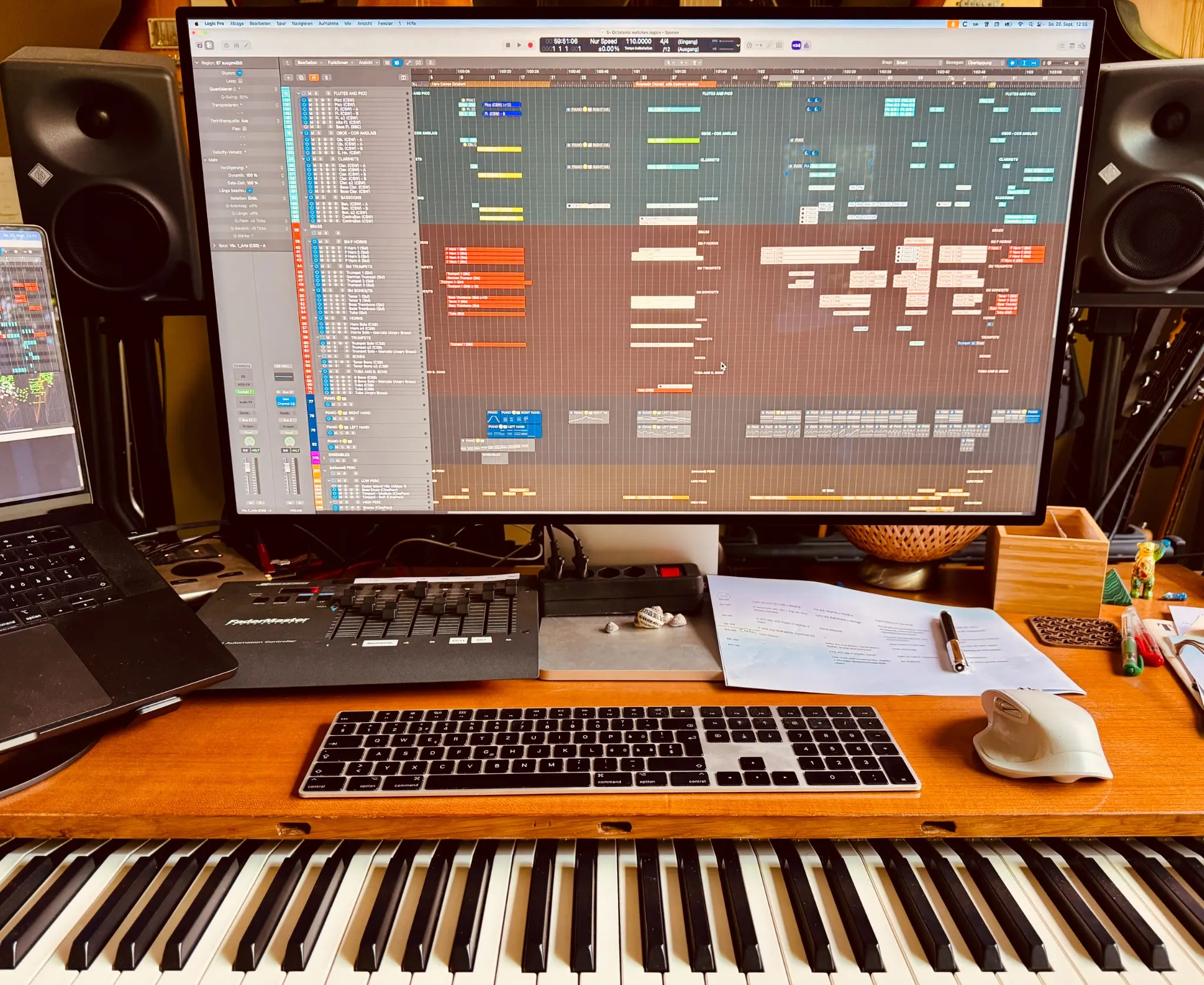 René Luther’s composition desk with Logic Pro session, keyboard and studio monitors