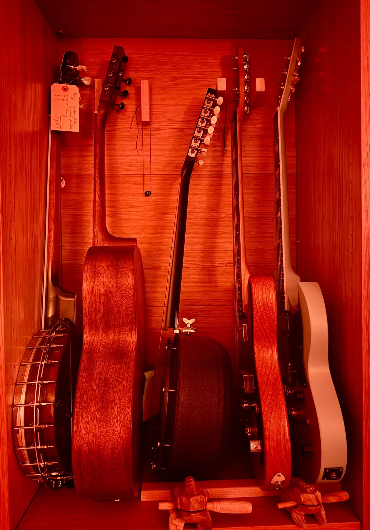 Wall-mounted string instruments illuminated at night