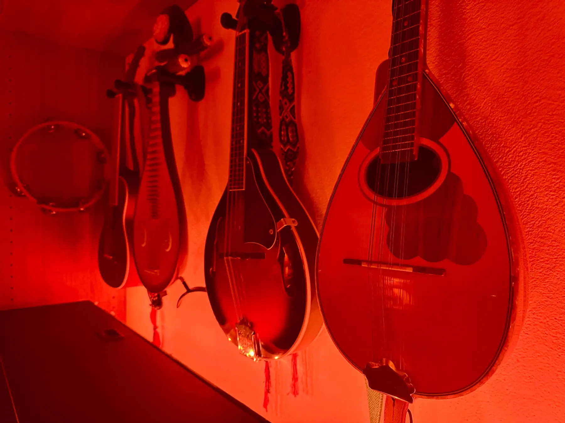 Violin, tambourine and string instruments in deep red night light